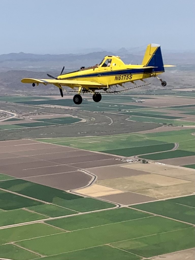 Air Tractor working low over row crops